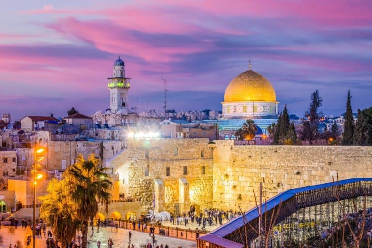 The Dome of the Rock, a tourist attraction in Israel, offers mesmerizing views at sunset in Jerusalem.